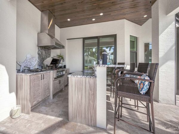 Luxurious Canal-Front Retreat with Caged Pool in Cape Coral