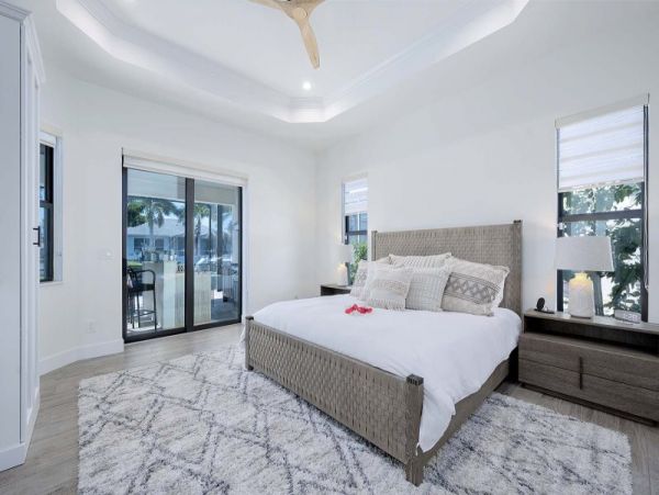 Luxurious Canal-Front Retreat with Caged Pool in Cape Coral