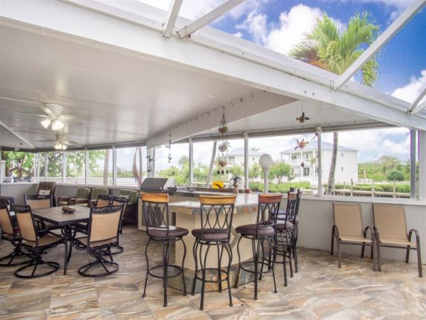Canal Front Vacation Home with Caged Pool & Boat Dock in Marathon