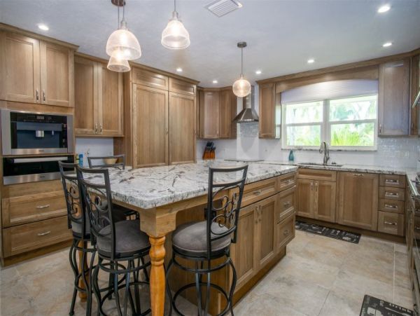 Canal Front Vacation Home with Caged Pool & Boat Dock in Marathon