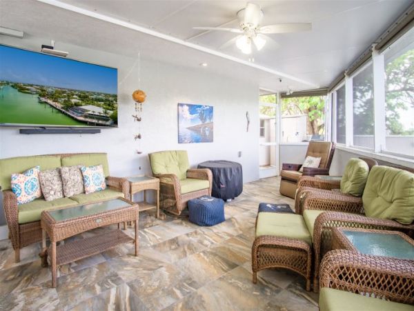 Canal Front Vacation Home with Caged Pool & Boat Dock in Marathon