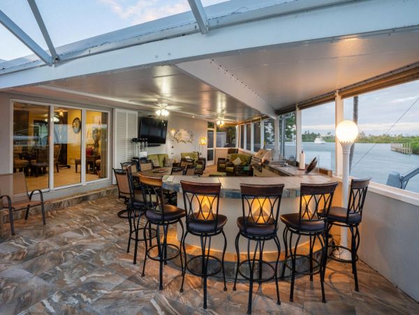 Canal Front Vacation Home with Caged Pool & Boat Dock in Marathon