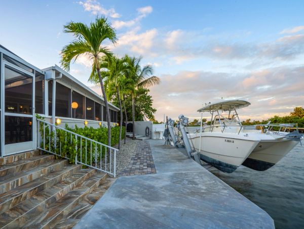 Canal Front Vacation Home with Caged Pool & Boat Dock in Marathon