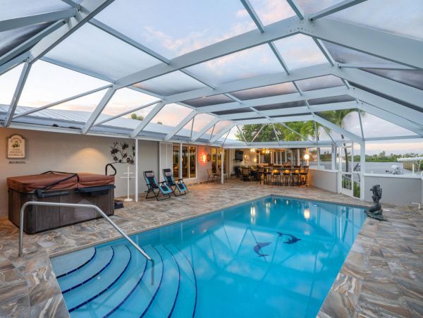 Canal Front Vacation Home with Caged Pool & Boat Dock in Marathon