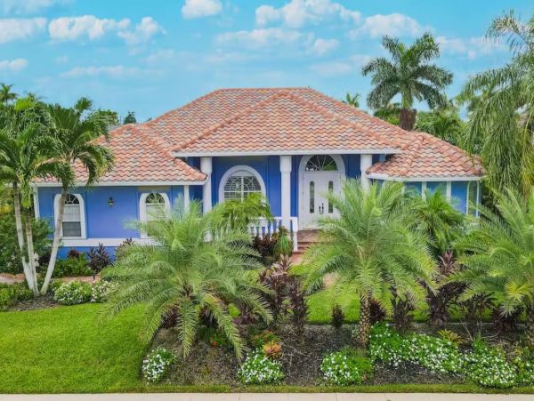 Marco Island Canalfront Four Bedroom Home with Caged Pool