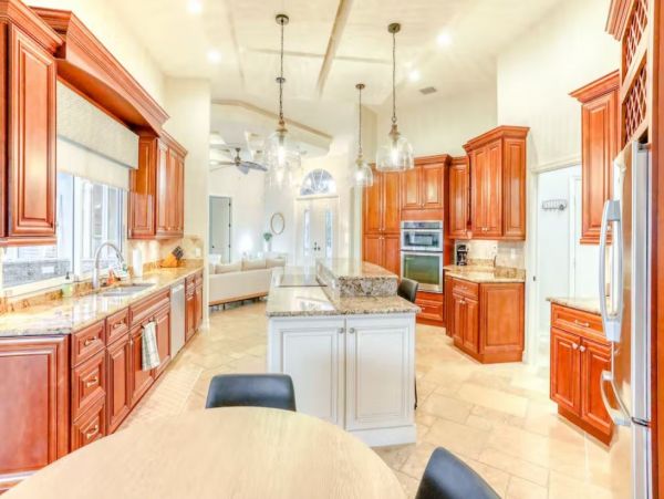 Marco Island Canalfront Four Bedroom Home with Caged Pool