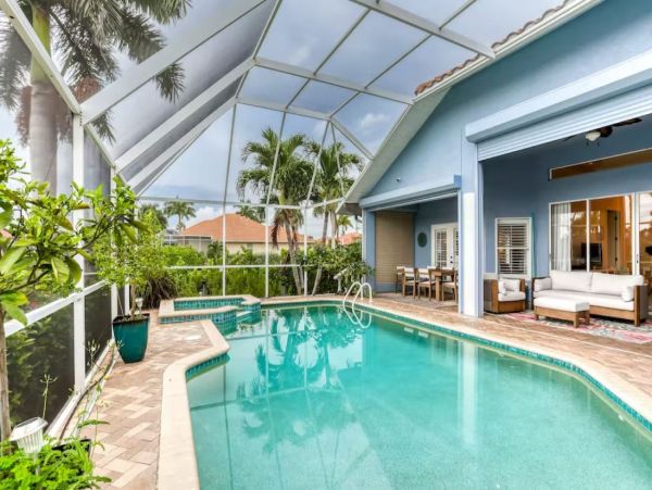 Marco Island Canalfront Four Bedroom Home with Caged Pool