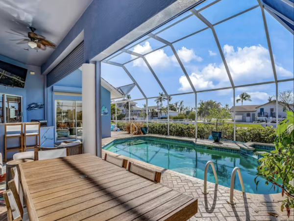 Marco Island Canalfront Four Bedroom Home with Caged Pool
