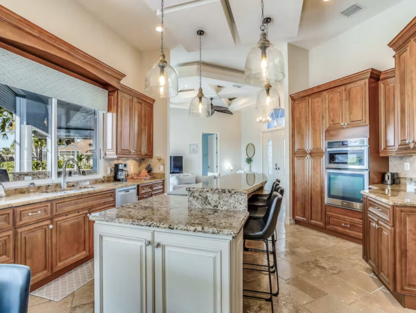 Marco Island Canalfront Four Bedroom Home with Caged Pool