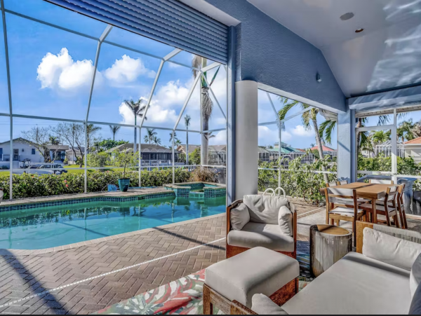Marco Island Canalfront Four Bedroom Home with Caged Pool