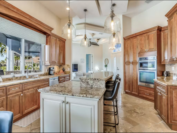 Marco Island Canalfront Four Bedroom Home with Caged Pool