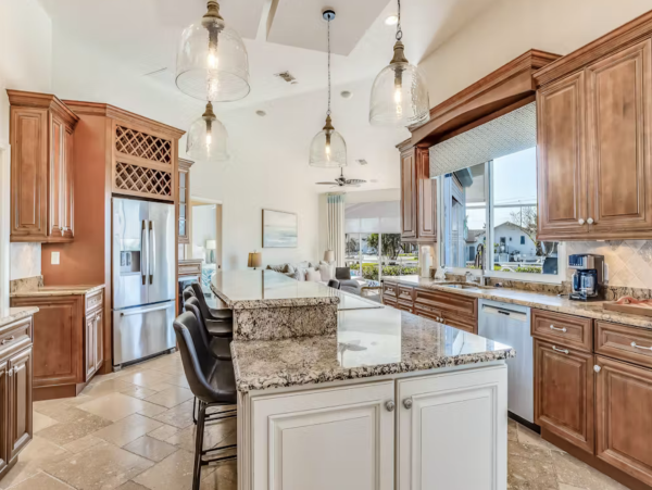 Marco Island Canalfront Four Bedroom Home with Caged Pool