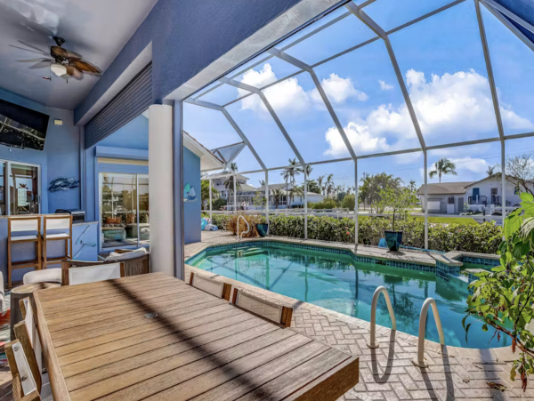 Marco Island Canalfront Four Bedroom Home with Caged Pool