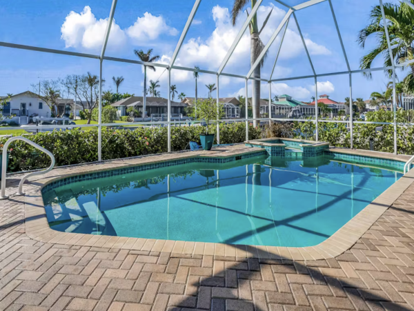 Marco Island Canalfront Four Bedroom Home with Caged Pool