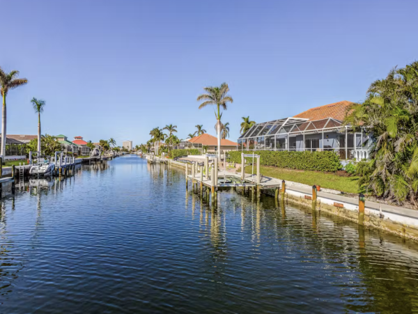 Marco Island Canalfront Four Bedroom Home with Caged Pool
