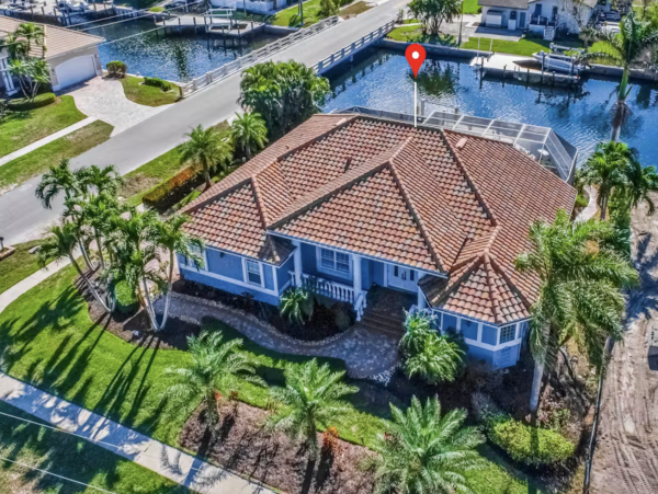 Marco Island Canalfront Four Bedroom Home with Caged Pool