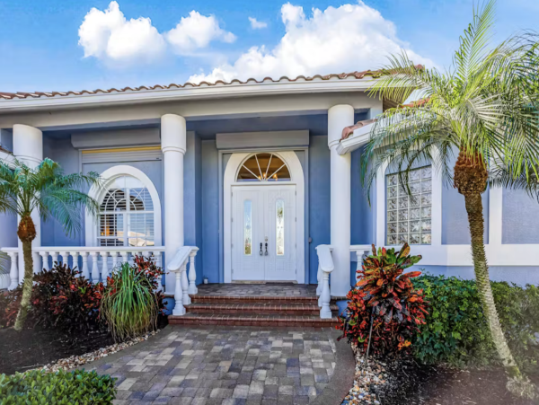 Marco Island Canalfront Four Bedroom Home with Caged Pool