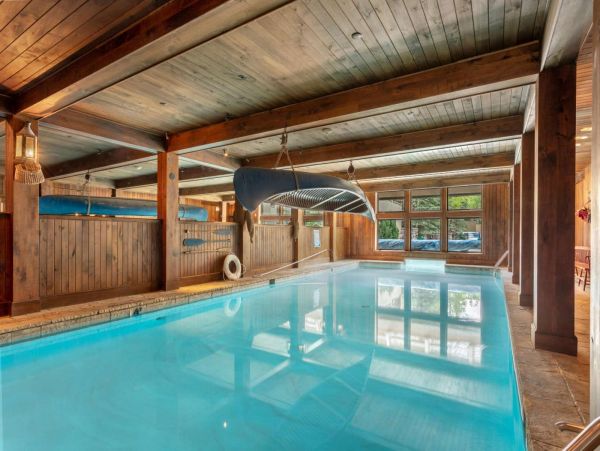 The indoor portion of the pool resembles a boat house and is 4 feet deep the entire length.