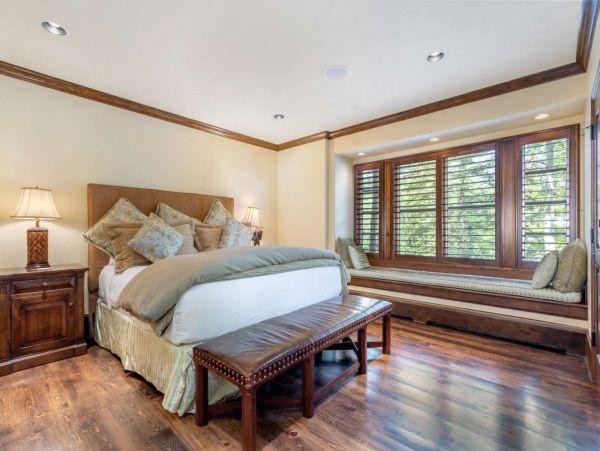 Retreat to the master suite with king bed and cozy window seating, located on entry level.