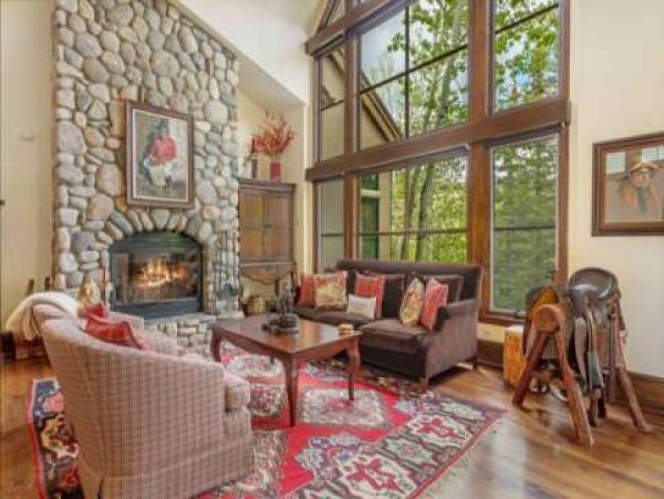 Stunning living room with wood burning fireplace.