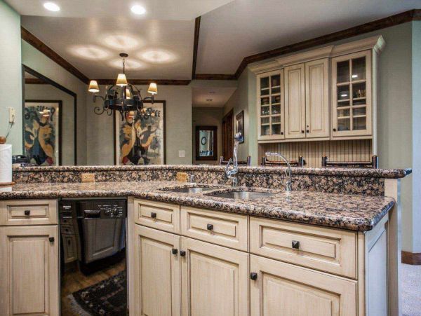 Fully equipped kitchen with granite counter tops and custom cabinetry.