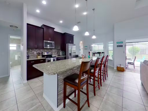 Tranquil Canal-Front Home with Caged Pool in Cape Coral
