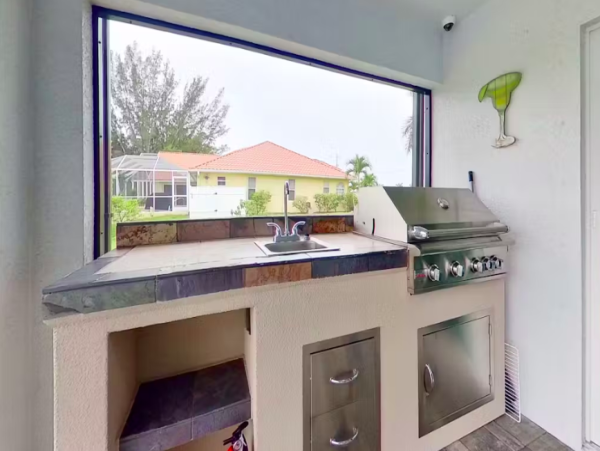 Tranquil Canal-Front Home with Caged Pool in Cape Coral