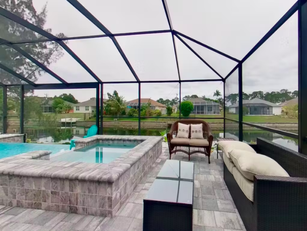Tranquil Canal-Front Home with Caged Pool in Cape Coral
