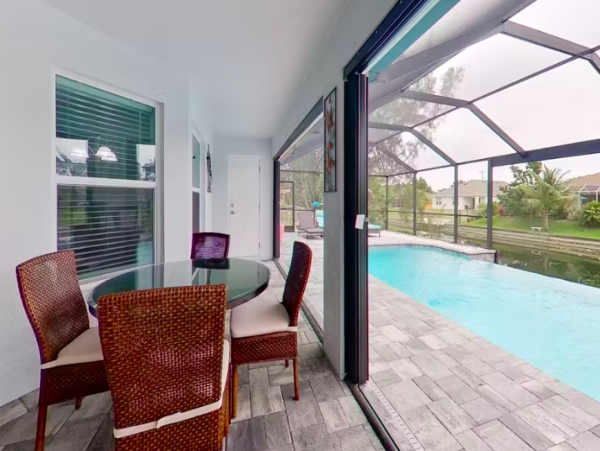 Tranquil Canal-Front Home with Caged Pool in Cape Coral