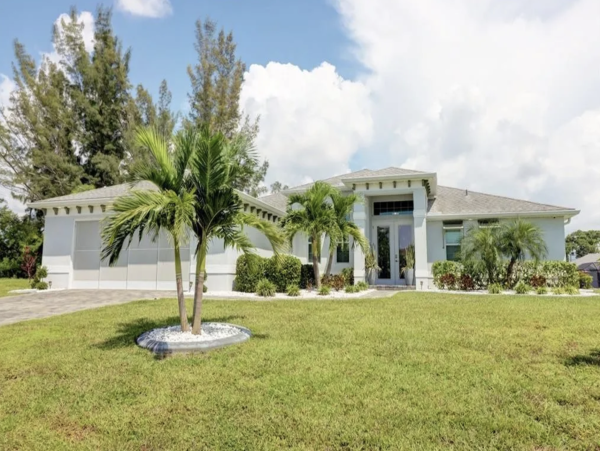 Tranquil Canal-Front Home with Caged Pool in Cape Coral