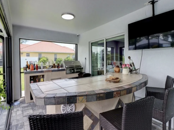 Tranquil Canal-Front Home with Caged Pool in Cape Coral