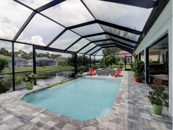 Tranquil Canal-Front Home with Caged Pool in Cape Coral