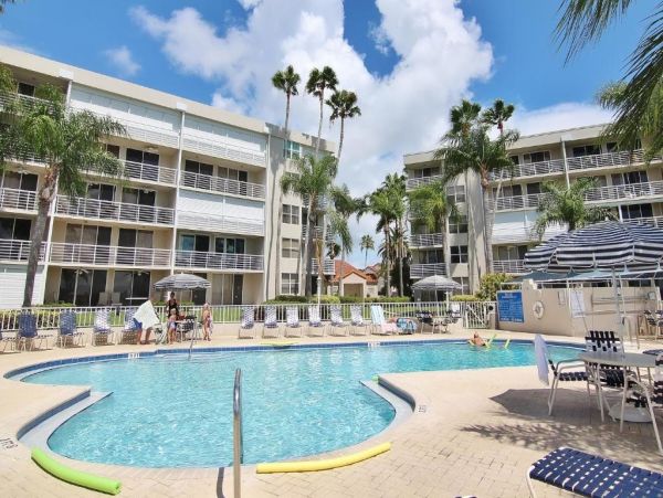 St. Pete Beach Vacation Rental Bayfront Condo with Pool & Balcony Views