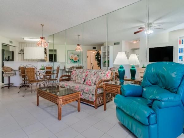 Coastal Comfort: Ground-Floor Retreat with Patio, Pool, & Beach Access