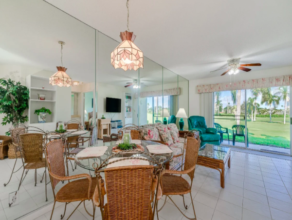 Coastal Comfort: Ground-Floor Retreat with Patio, Pool, & Beach Access