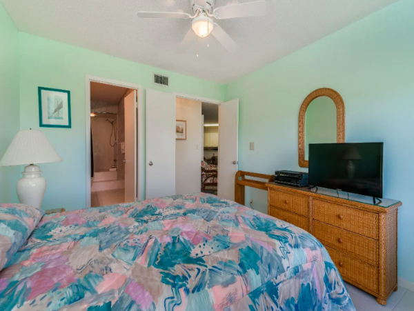 Coastal Comfort: Ground-Floor Retreat with Patio, Pool, & Beach Access