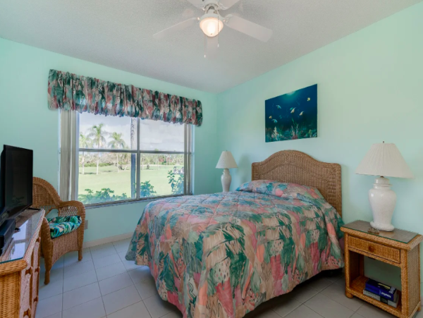 Coastal Comfort: Ground-Floor Retreat with Patio, Pool, & Beach Access