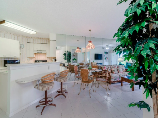 Coastal Comfort: Ground-Floor Retreat with Patio, Pool, & Beach Access