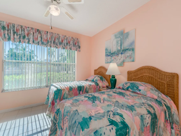 Coastal Comfort: Ground-Floor Retreat with Patio, Pool, & Beach Access