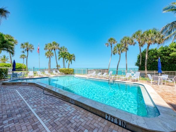 Beach front condo steps to the village