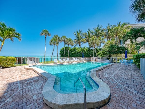 Beach front condo steps to the village