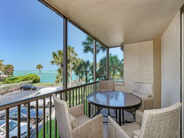 Beach front condo steps to the village