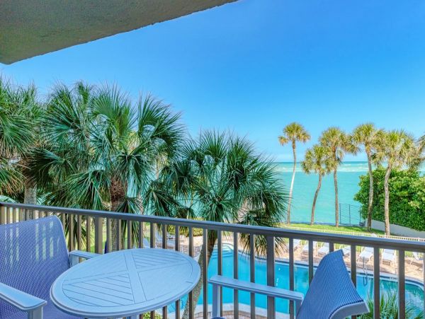 Beach front condo steps to the village