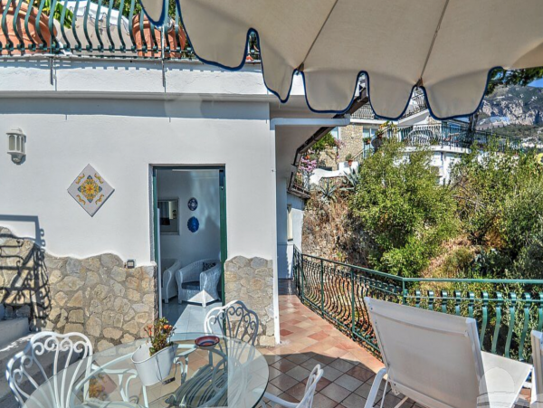 A Charming villa set into the cliff, sheer above the sea