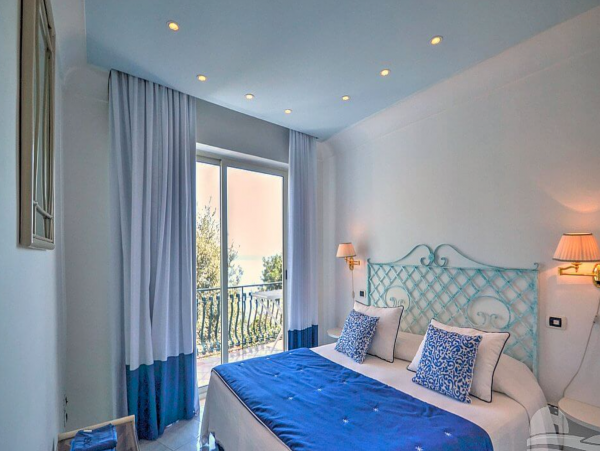 A Charming villa set into the cliff, sheer above the sea