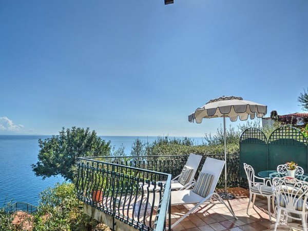 A Charming villa set into the cliff, sheer above the sea