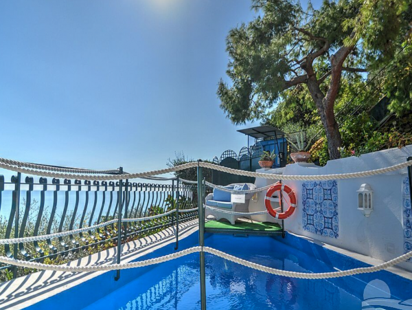 A Charming villa set into the cliff, sheer above the sea