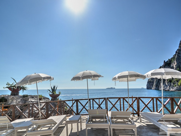 A Charming villa set into the cliff, sheer above the sea
