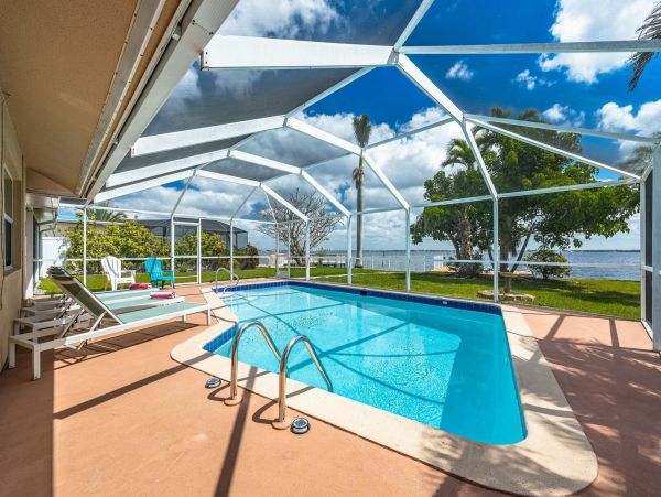 Cape Coral Four Bedroom Luxury Retreat with Caged Pool