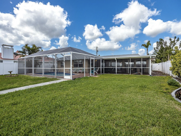 Cape Coral Four Bedroom Luxury Retreat with Caged Pool